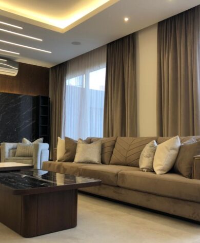 Living room with marble covered TV unit