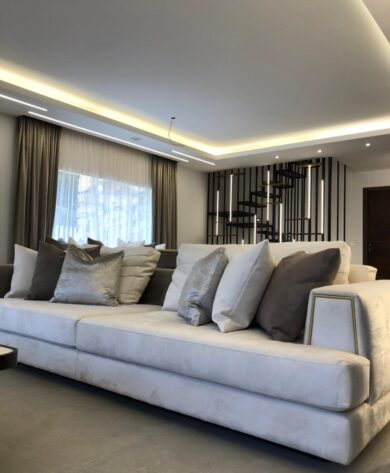 Long white couch with 6 cushions